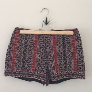 Red and white embroidered black shorts